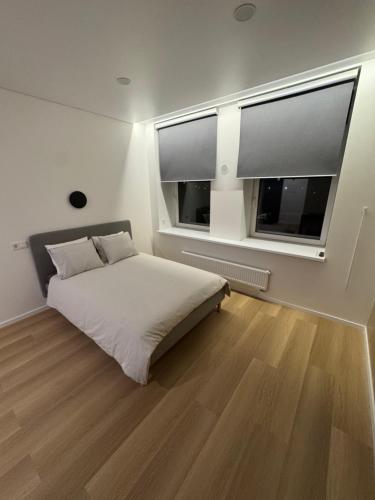 Postel nebo postele na pokoji v ubytování 10 New Airport Apartment