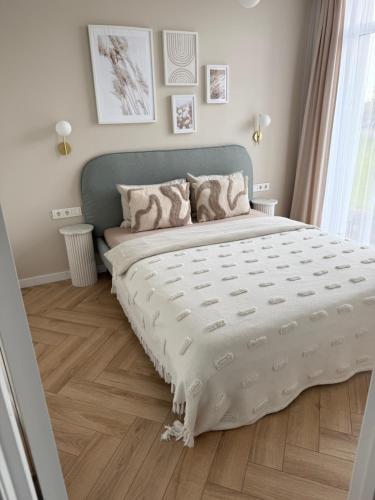 Letto o letti in una camera di Sunny apartment- Parko rezidencija SELF CHECK-IN
