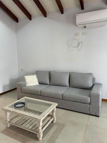 a living room with a couch and a coffee table at Casa Bonita in Goya