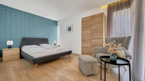 Ένα ή περισσότερα κρεβάτια σε δωμάτιο στο Apartamenty Nautica blisko plaży