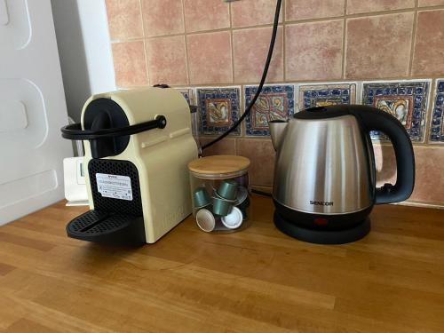 a coffee maker and a toaster on a counter at Apartmán Česká Kamenice in Česká Kamenice