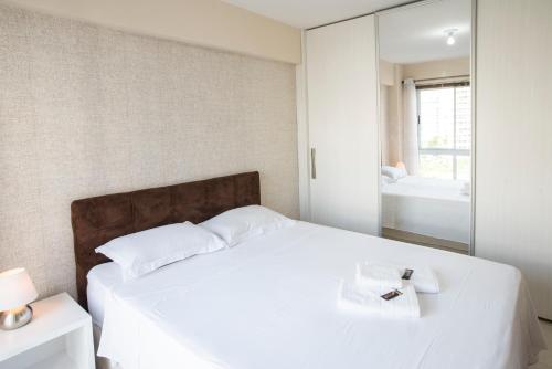 Llit o llits en una habitació de Apartamento Luxo Barra