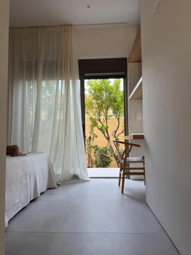 Katil atau katil-katil dalam bilik di Lagouvardos Beach House