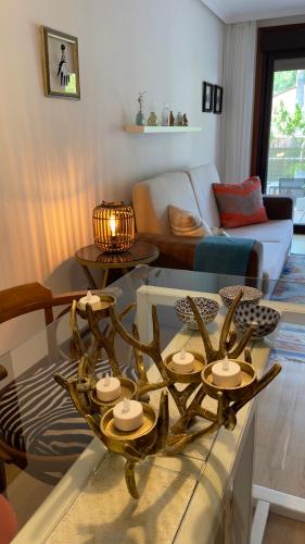 a living room with a table and a couch at Pombal Bayona in Baiona