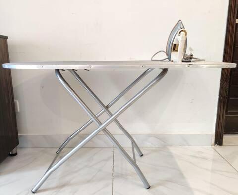 a white desk with a metal frame in a room at Luxury Villa - 1 Kanal Furnished 5 bedrooms , DHA Phase 6 in Lahore