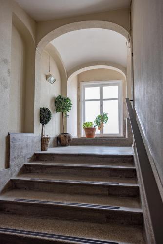 a staircase in a building with potted plants at Appartement dijk Middelkerke met zeezicht in Middelkerke