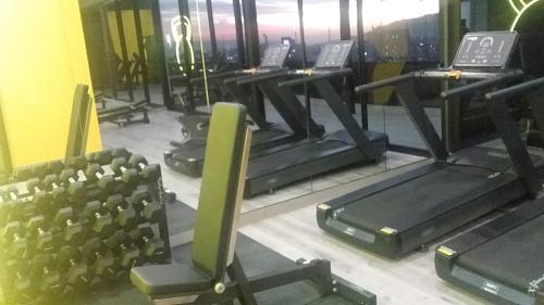 a row of treadmills in a gym at Chic Studio in Barrio Escalante in Tapantí