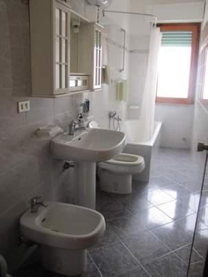 a bathroom with a sink and a toilet at Casa vacanze Giada in Peschici