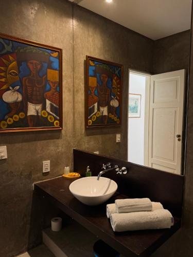 a bathroom with a sink and a mirror at RARO Ipanema Boutique Hotel in Rio de Janeiro