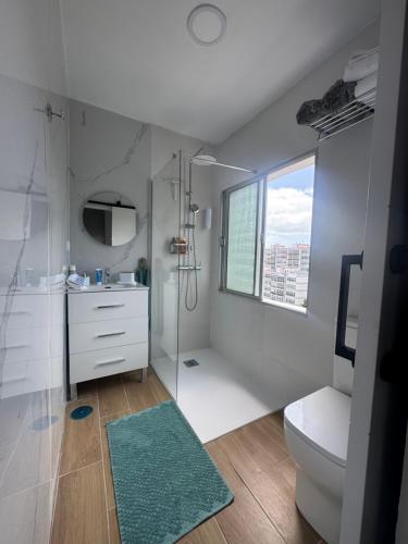 a bathroom with a shower and a toilet and a sink at Room Mayi GC in Las Palmas de Gran Canaria