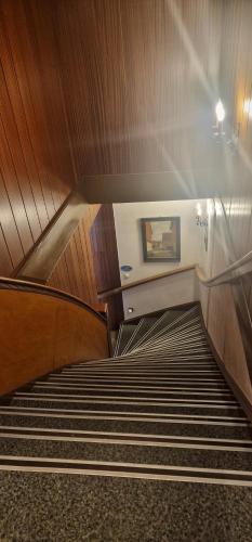 an escalator with stairs in a building at Hotel-Restaurant Wilhelmsbad in Seesen