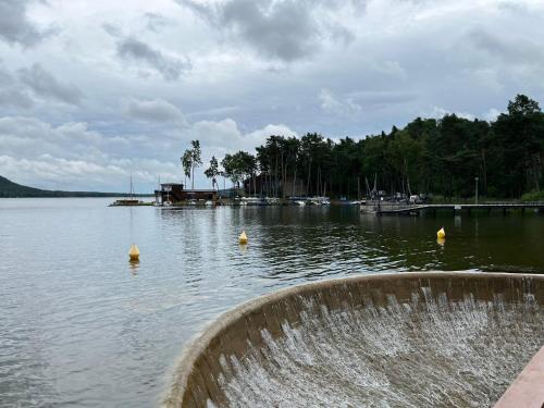 a large body of water with yellow balls in it at Chata Veverka in Doksy