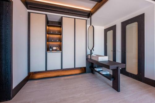 a dressing room with a table and a mirror at Noir Mykonos in Mýkonos City