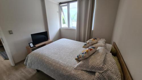 Ένα ή περισσότερα κρεβάτια σε δωμάτιο στο Comodo y acogedor departamento