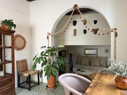 a living room with a table and a couch at Artisanal Loft Coyoacan in Mexico City