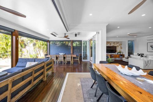 a living room with a couch and a table at Golden Beach Luxury for Families in Golden Beach