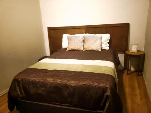 Ένα ή περισσότερα κρεβάτια σε δωμάτιο στο Hotel Bugambilia
