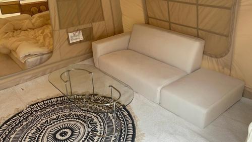 a small room with a chair and a bed at Avila The Oasis in Kwangp'o