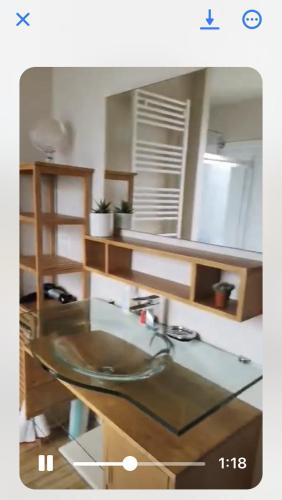 La salle de bains est pourvue d'un lavabo en verre. dans l'établissement Chez nous, à La Celle-sous-Gouzon