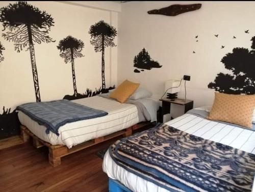 Postel nebo postele na pokoji v ubytování Tipico Hostel Chile