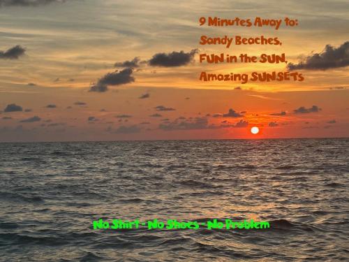 a sunset over the ocean with the words minutes away for sandy beaches fun in at Magic Secluded Suite-Pool-Sauna plus Lake View Venice Florida in Venice
