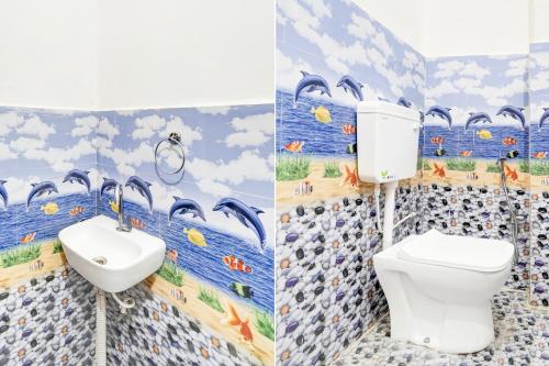 a bathroom with a toilet and a sink at SPOT ON Hotel Vardaan in Prayagraj