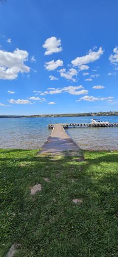 a dock in the middle of a body of water at Um lugar de charme e aconchego - Lírio! in Brasilia