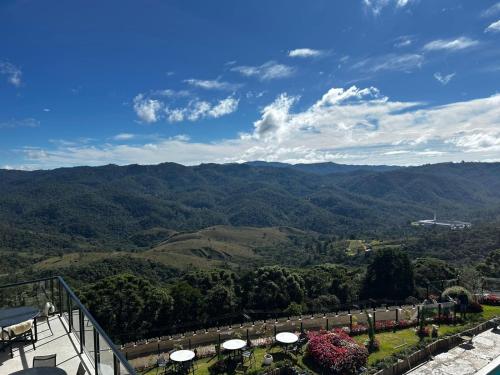a view of the mountains from a balcony at Gran Paradiso Campos do Jordão - Resort in Campos do Jordão