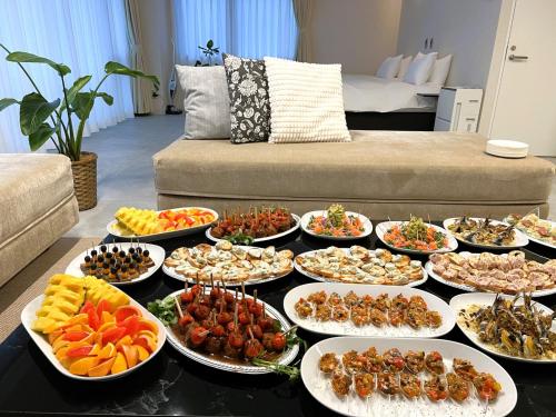 a buffet of food on a table in a living room at MARSOL CS Beach hotel in Chigasaki