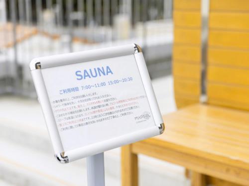 a sign that says summa sitting next to a table at MARSOL CS Beach hotel in Chigasaki