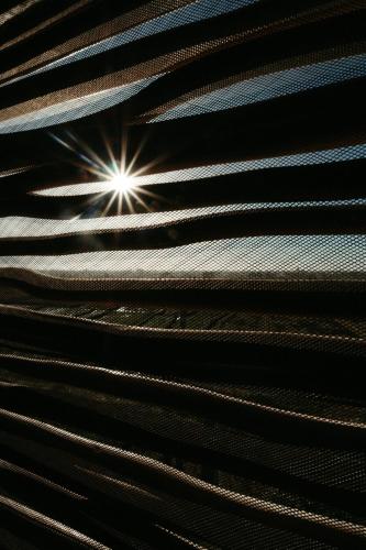 a close up of a ceiling with a light at The Iggy Hotel Seseh Studio 2 in Cemagi