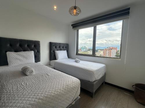 Una cama o camas en una habitación de NEO Apartamento 2 Habitaciones, Cerca Oakland Place