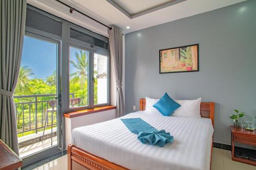 Giường trong phòng chung tại Mai Boutique Villa Hoi An
