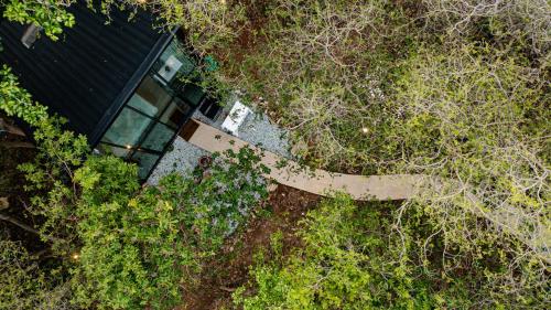 an overhead view of a house surrounded by trees at Issara Bar&House in Ko Larn