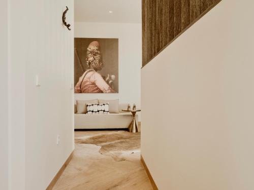 a hallway with a painting on the wall at Comfy Studios Hotel in Benalmádena