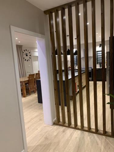 a living room with a sliding door leading to a kitchen at Fully Furnished and Modern House in Mauritius in Quatre Bornes