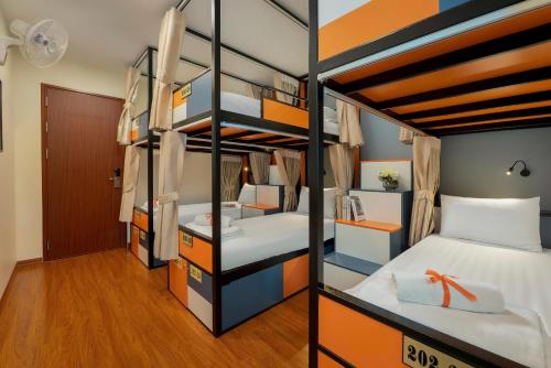 Ένα ή περισσότερα κρεβάτια σε δωμάτιο στο TamCoc Backpack Chill Hostel