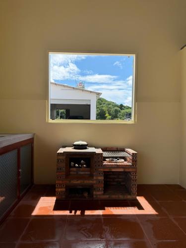 a window in a room with a table in front of it at Xóm Giữa homestay in Ha Tien