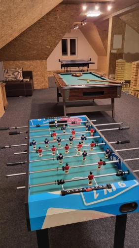 two pool tables in a room with billards at Dom na Ubocy in Groń