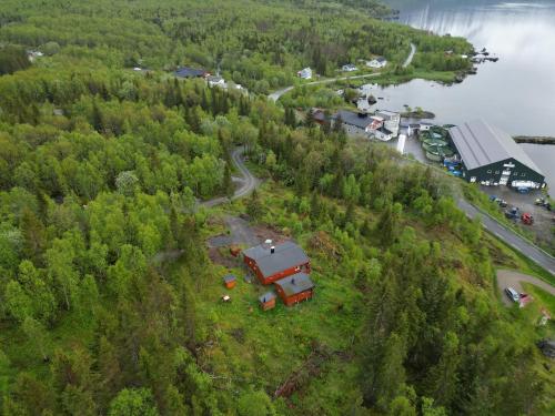 an aerial view of a truck parked on a hill next to a river at Maxi Cabin with Sauna and Jacuzzi in Kovan