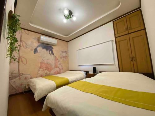 Postel nebo postele na pokoji v ubytování 箱根御泊処-桜華- 049aH