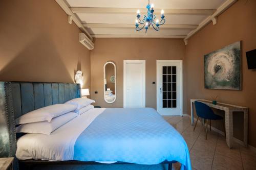 Un ou plusieurs lits dans un hébergement de l'établissement Panorama Suites Noto - Adults Only
