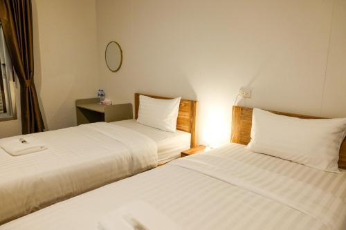 Ένα ή περισσότερα κρεβάτια σε δωμάτιο στο Au samlor guesthouse