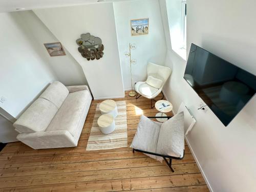 Posezení v ubytování Le Duplex Appartement