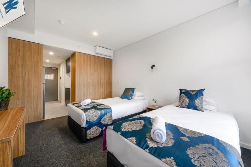 Cama o camas de una habitación en The Park OASIS Burwood
