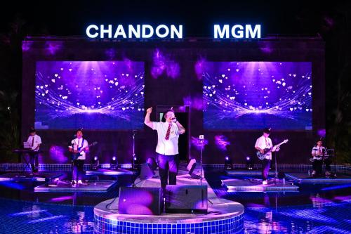 a man on a stage with a group of musicians at MGM Grand Sanya in Sanya