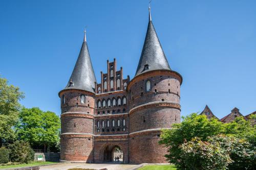 a castle with two towers on top of it at K 357 - Low budget Hotel in Ratekau bei Lübeck in Ratekau
