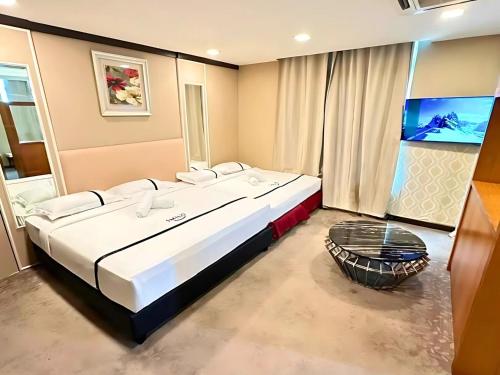 Postel nebo postele na pokoji v ubytování Seeds Hotel Kuala Selangor