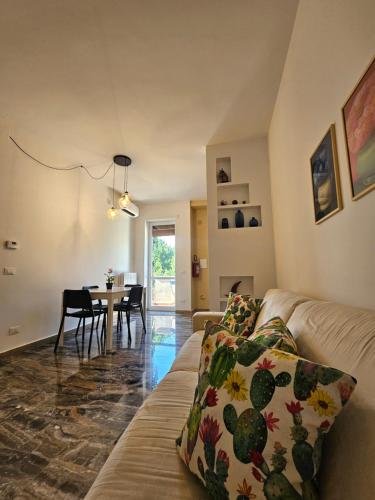 a living room with a couch and a table at Mami House Lecce in Lecce
