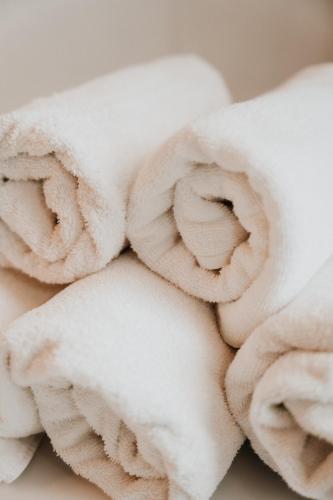 a pile of white towels stacked on top of each other at Appartement Zentrum in Wagrain